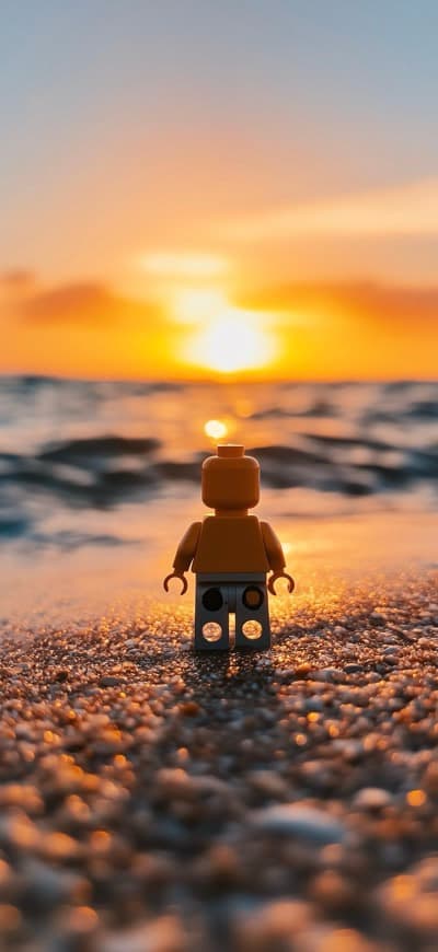 Lego Guy Against Sunset On Beach